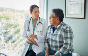 Doctor speaks with male patient