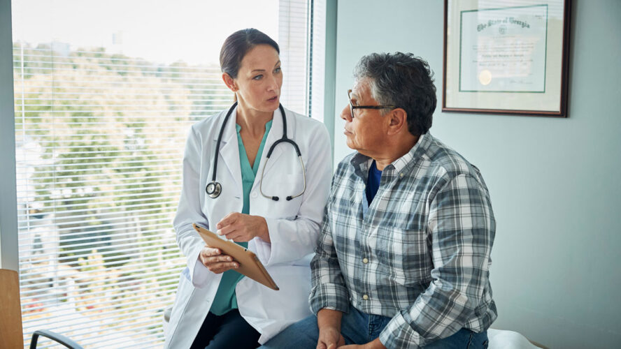 Doctor speaks with male patient