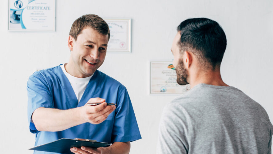 panoramic shot of smiling Physiotherapist with diagnosis near patient in hospital