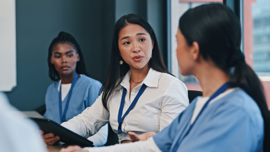 Medical team, tablet and consulting in hospital with doctor, meeting and diversity at work. Healthcare, nursing and health support staff with tech for patient info or test results and communication