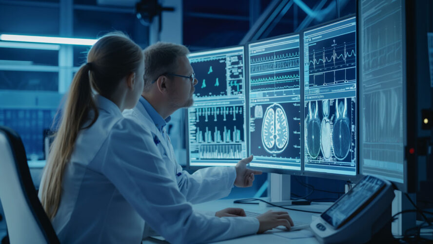 Medical professionals in a high-tech laboratory analyzing detailed imaging results on multiple computer monitors, showcasing advanced diagnostic technology and collaborative work in modern medicine