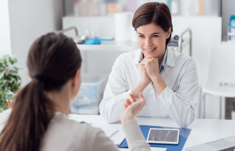 Doctor working in the office and listening to the patient, she is explaining her symptoms, healtcare and assistance concept