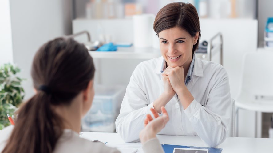 Doctor working in the office and listening to the patient, she is explaining her symptoms, healtcare and assistance concept