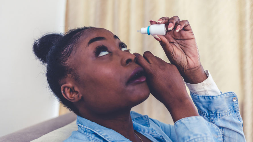 Woman using eye drop, woman dropping eye lubricant to treat dry eye or allergy, sick woman treating eyeball irritation or inflammation woman suffering from irritated eye, optical symptoms.