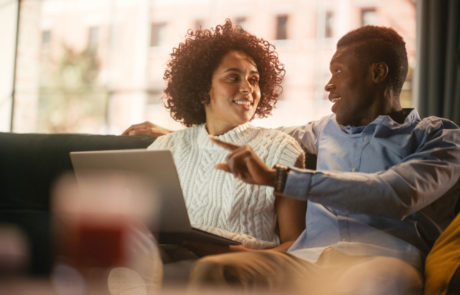 Lovely Black Couple Use Laptop Computer with Conference Video Call App to Cha