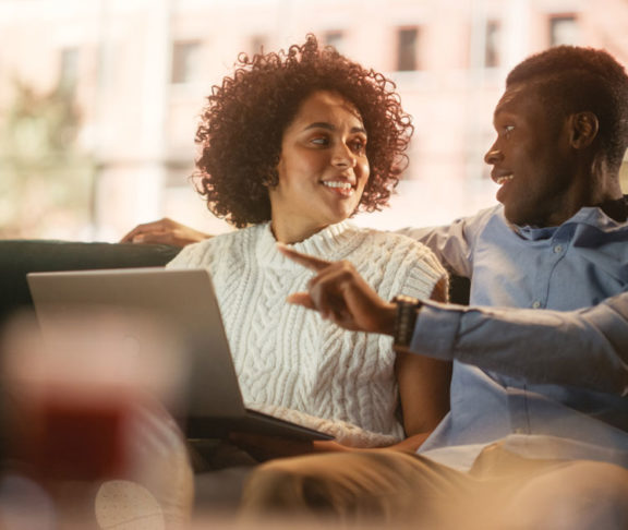 Lovely Black Couple Use Laptop Computer with Conference Video Call App to Cha