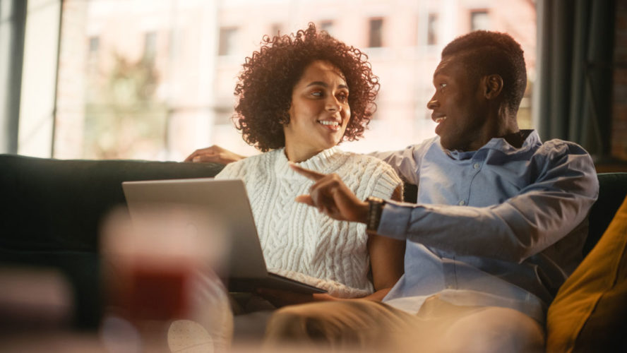 Lovely Black Couple Use Laptop Computer with Conference Video Call App to Cha