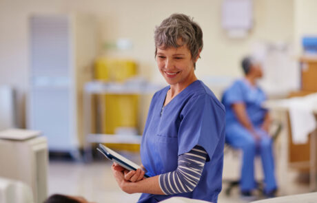 Shot of a nurse standing by her patient's bedside