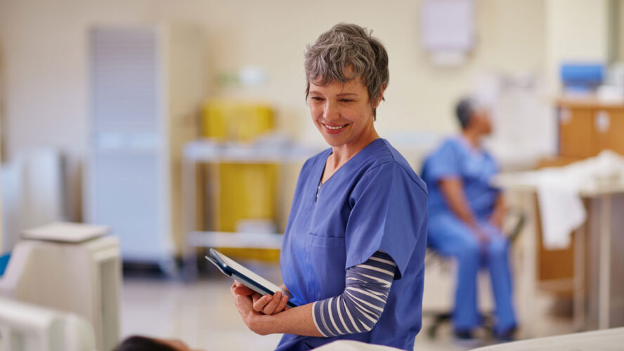 Shot of a nurse standing by her patient's bedside