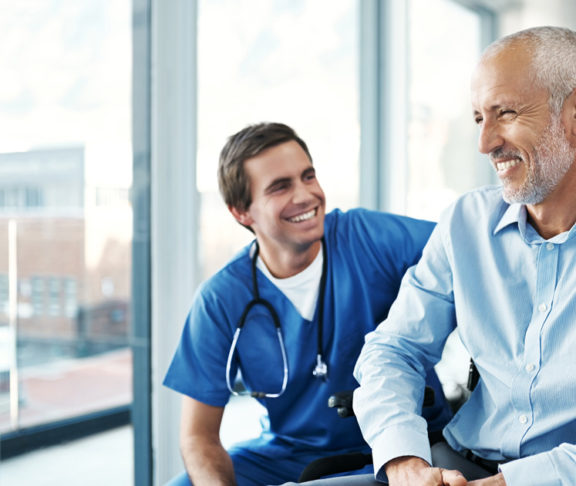 Shot of a male nurse caring for a senior patient