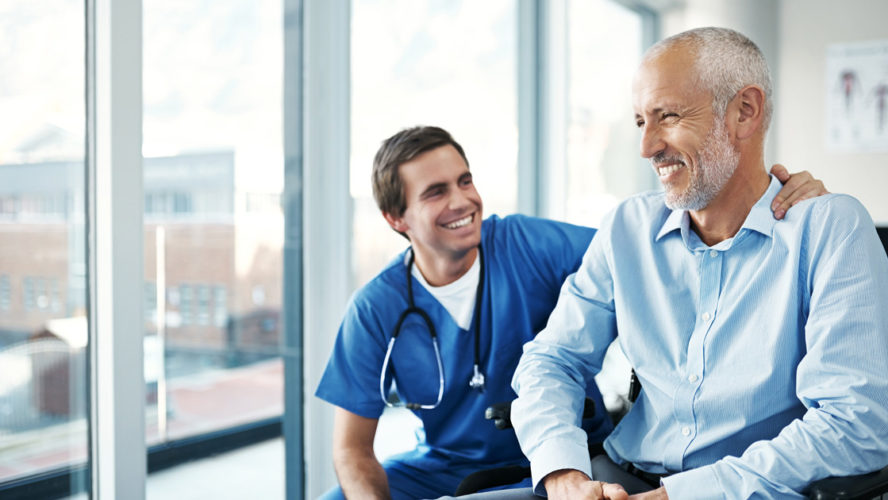 Shot of a male nurse caring for a senior patient
