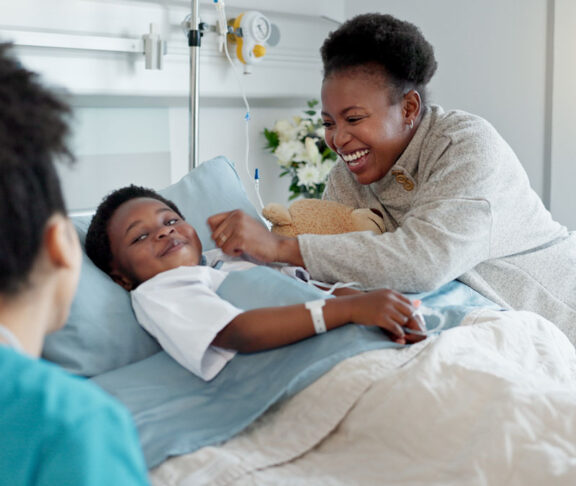Mom, nurse and black child patient in hospital for recovery of surgery for congenital heart disease. Checkup, sick and cardiology medical worker with happy mother and kid for postoperative care