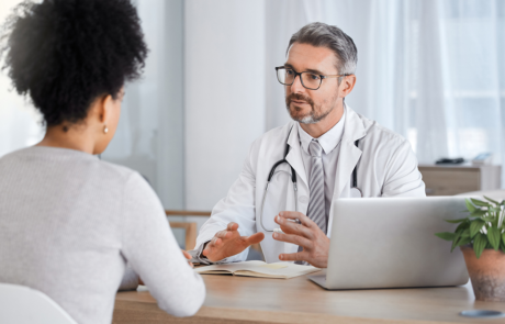 Healthcare, consultation and doctor talking to woman in after checkup